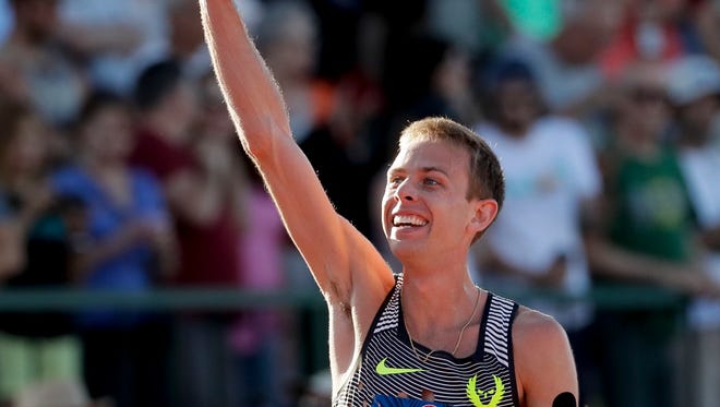 Galen Rupp celebrates after winning the during the men's 10,000-meter run final at the U.S. Olympic Track and Field Trials, Friday, July 1, 2016, in Eugene Ore. (AP Photo/Matt Slocum)