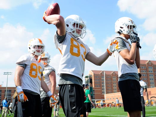 BJ Bishop (83) throws the ball back during a drill