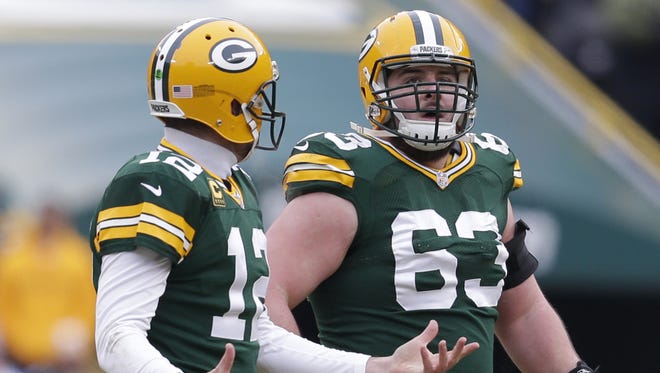 Green Bay Packers center Corey Linsley, right.