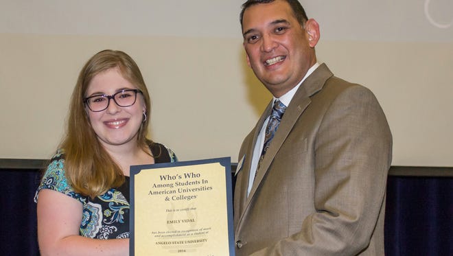 Emily Vidal receives her “Who’s Who” certificate from Dr. Javier Flores, Angelo State University vice president for student affairs and enrollment management.