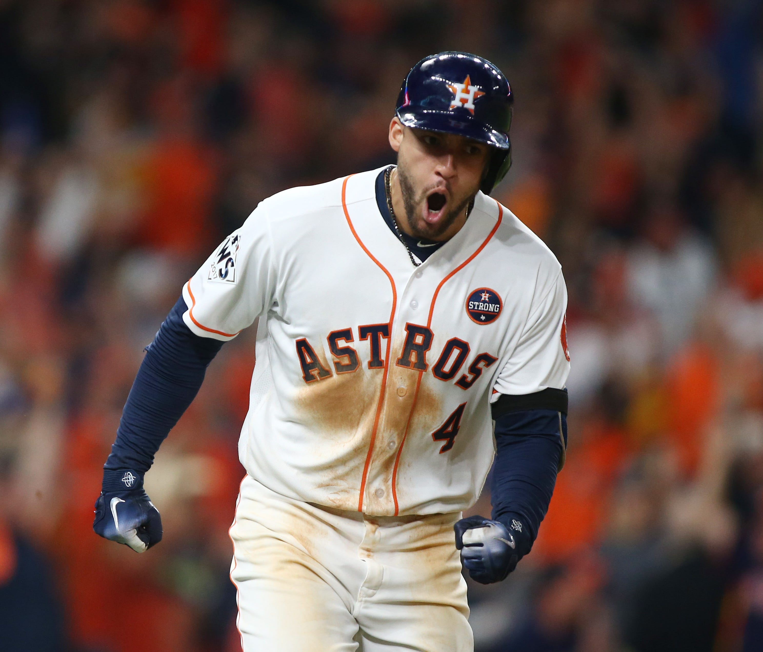 Houston Astros center fielder George Springer (4) celebrates after hitting a solo home run in the seventh inning of Game 5 of the World Series.