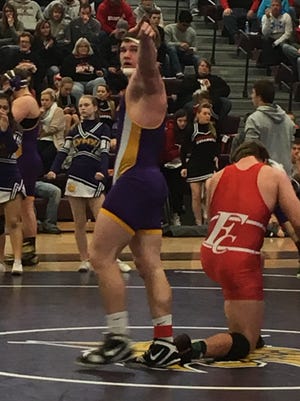 Webster City's Gavin Dinsdale celebrates a 6-3 win against No. 2 Alex Paulson of Forest City.