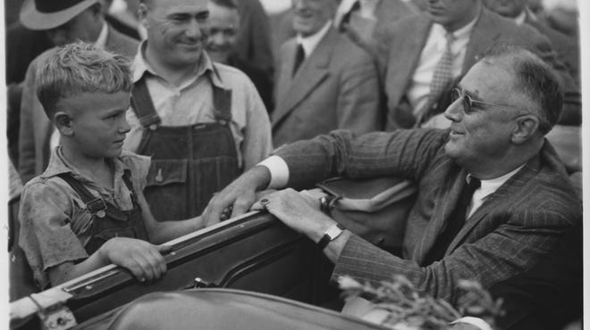 As seen in “The Roosevelts: An Intimate History,” President Franklin Delano Roosevelt greets drought-stricken farmers in North Dakota, 1936.