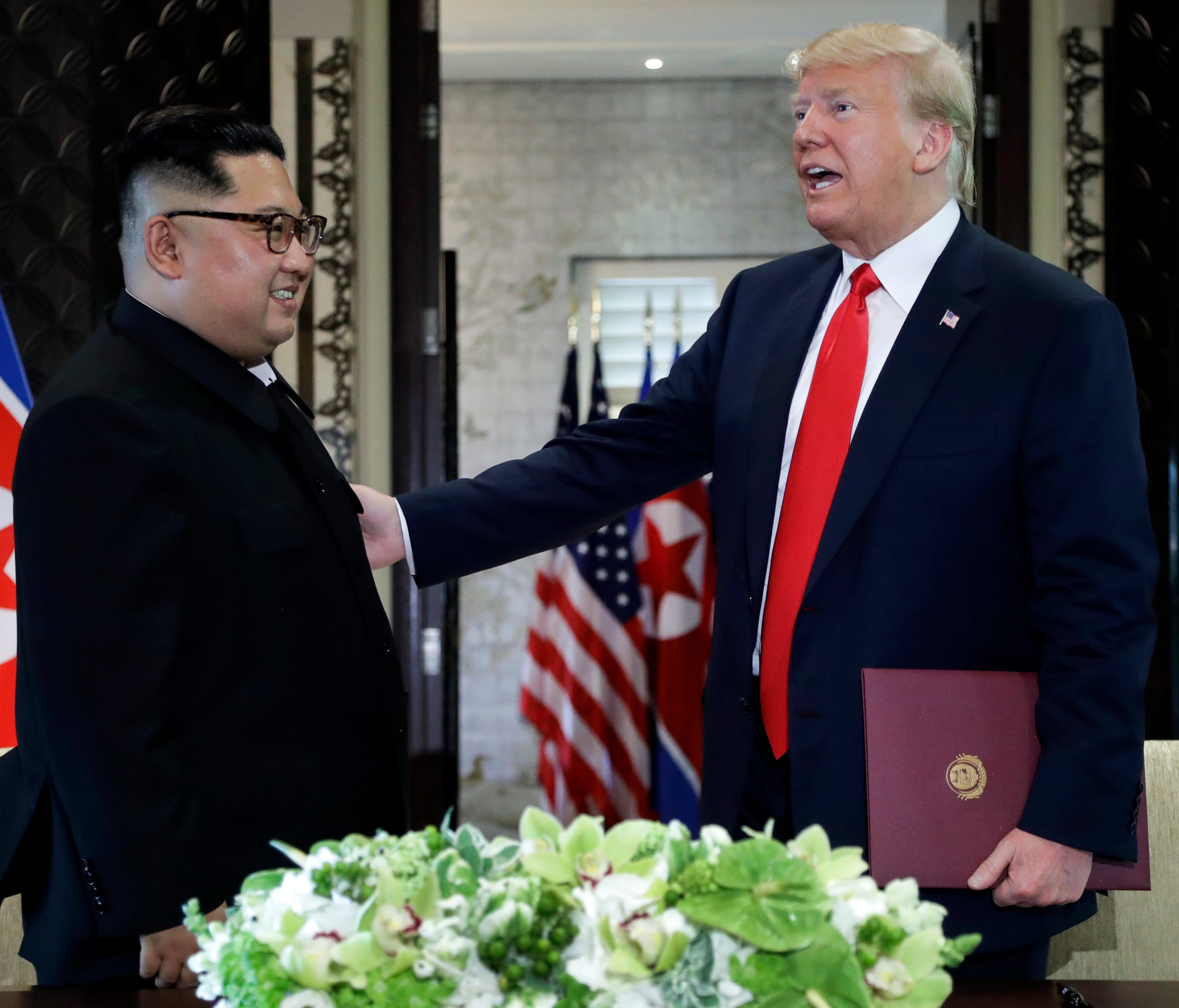 President Trump and  North Korea leader Kim Jong Un after they signed documents at their Singapore summit.