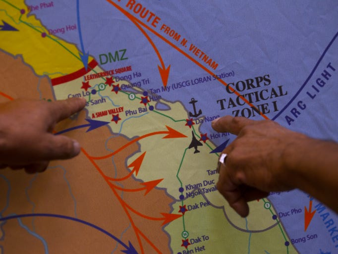 Veterans point at a map of Vietnam Thursday at Navajo