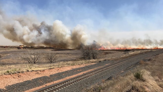 A fire near Amarillo in Potter County burned almost 30,000 acres and threatened about 150 homes before being 100 percent contained Tuesday evening, the Texas A&M Forest Service said.