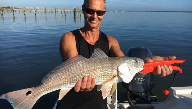 Steve, with one of three slot redfish!