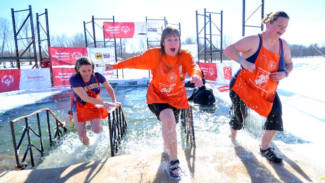 Participants plunged into the frigid water during Saturday's Polar Plunge at Sunnyvale Park in Wausau. The annual event benefits Special Olympics Wisconsin.