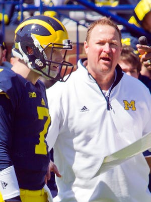 Michigan quarterback Shane Morris (7) listens to direction from offensive coordinator Tim Drevno, right, during the NCAA college football team's spring game in Ann Arbor, Mich., Saturday, April 4, 2015.