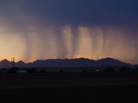 Bands of rain move over Phoenix during a monsoon storm