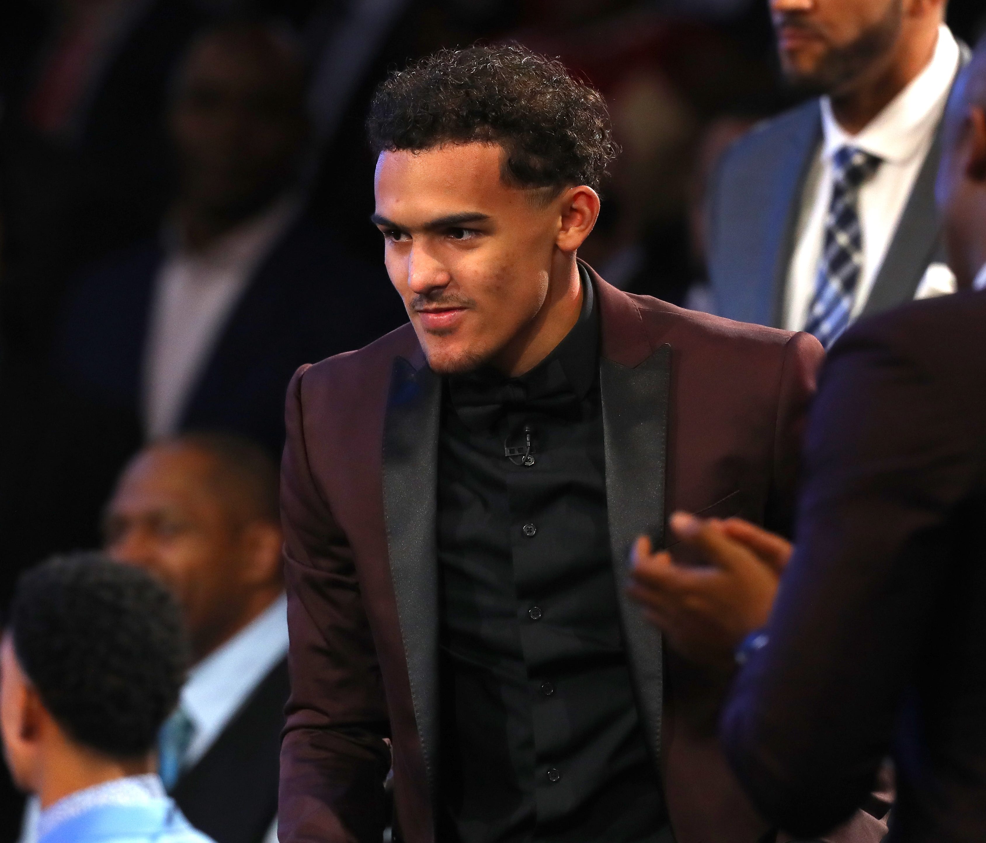 Trae Young reacts after being drafted fifth overall by the Dallas Mavericks during the 2018 NBA draft.