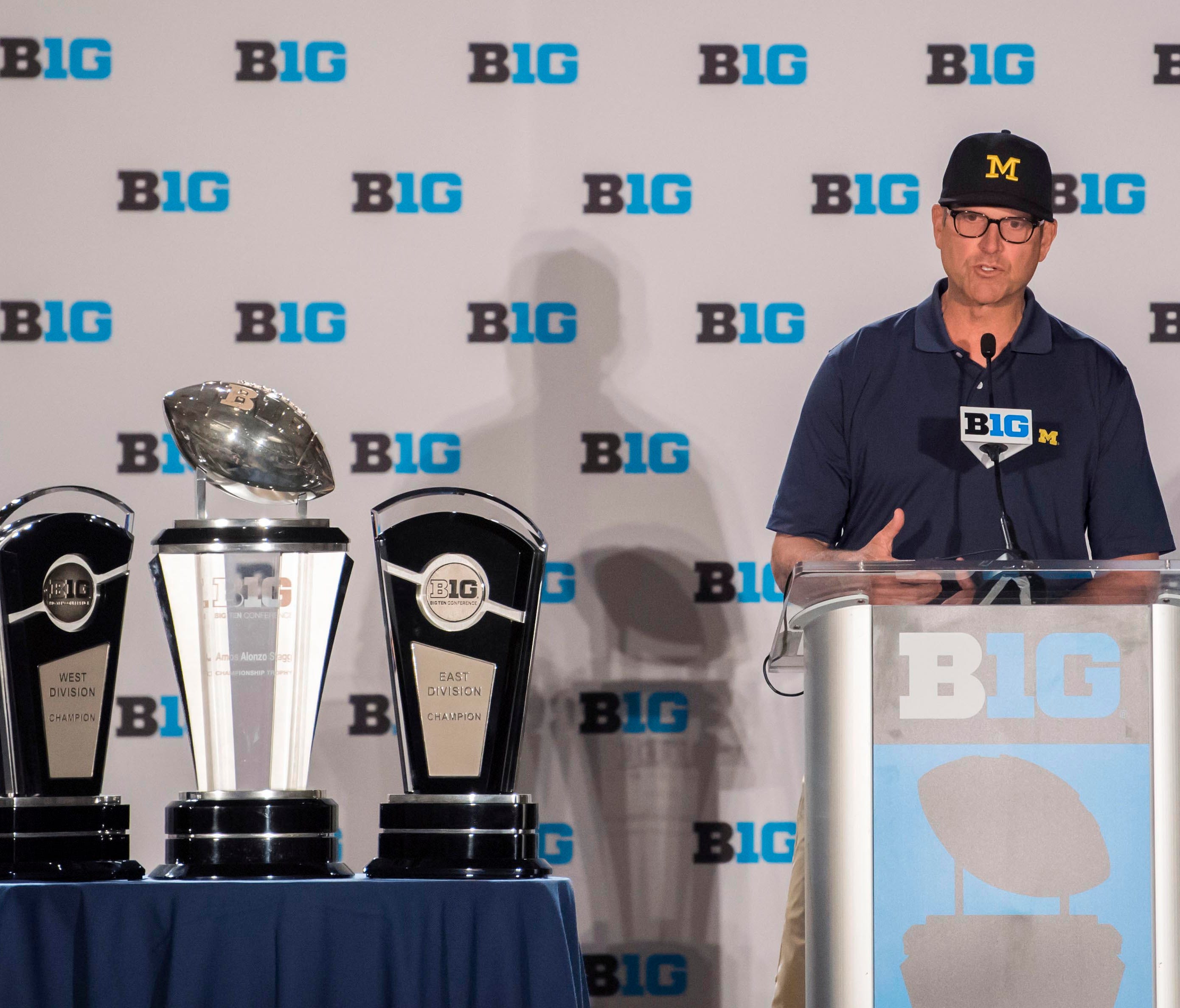 Michigan head coach Jim Harbaugh addresses reporters at Big Ten Media Days.