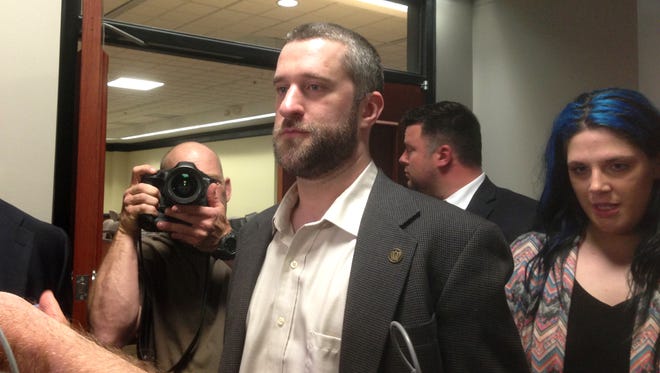 Television actor Dustin Diamond, center, leaves court in Port Washington, Wisc. on May 29, 2015, after being convicted of two misdemeanors stemming from a barroom fight on Christmas Day 2014.