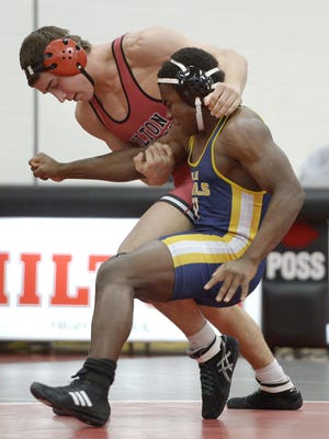Hilton's Lou DePrez, left against Victor's Joe Theede on Jan. 11, has wrestled at 182, 195 and 220 pounds this season.
