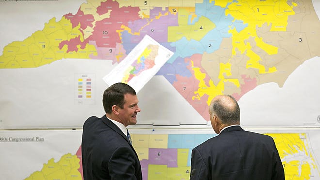 A growing number of states are considering changing the criteria or methods used to draw congressional and state legislative districts. Pictured: North Carolina Republican state Sens. Dan Soucek, left, and Brent Jackson review historical maps during the Senate Redistricting Committee in 2016.