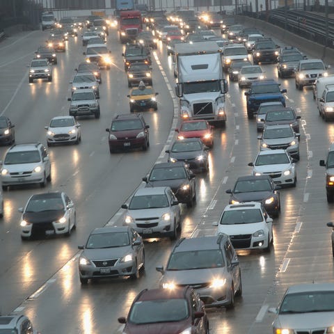 Travelers sit in a massive traffic jam as people h