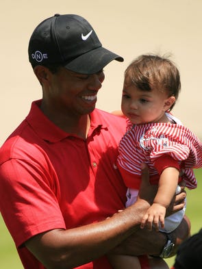 At the 2008 U.S. Open, Tiger Woods holds his daughter