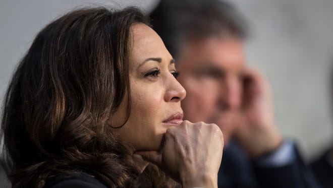 Sen. Kamala Harris, D-Calif., listens to testimony Wednesday from top national security chiefs during a Senate Select Committee on Intelligence hearing on gathering intelligence on foreign agents.