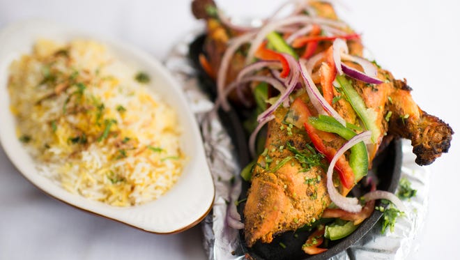 Tandoori chicken dish with rice from Aroma Indian Bistro in Merchantville.