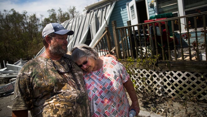 Robby Daffin consoles his mother, Nancy Daffin, as she returns to her destroyed home on Plantation Island for the first time on Wednesday, September 13, 2017 in Everglades City, three days after Hurricane Irma. "I care about her more than anything," said Daffin. During the eye of Hurricane Irma, Daffin drove to his mother's house to check on it. While leaving Plantation Island, Daffin became trapped by rapid flood waters and feared for his life. After finally contacting his son on Snapchat, he was rescued from the bridge. 