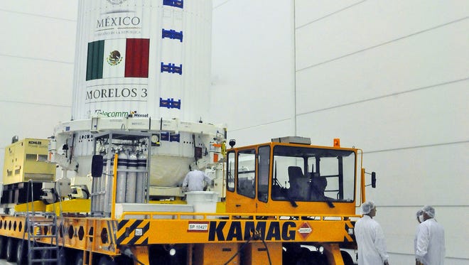 Crews prepare Mexico's Morelos 3 satellite for its Friday, Oct. 2, 2015 launch from Cape Canaveral.