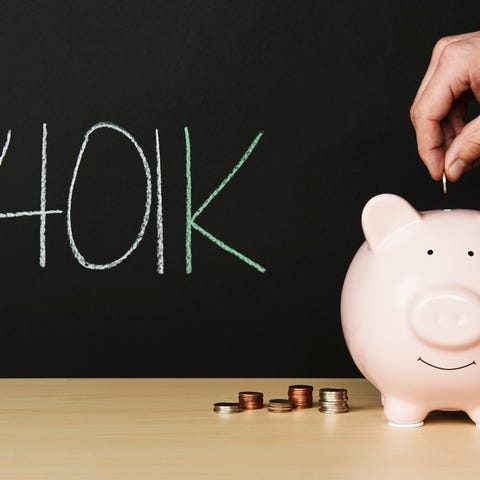 Piggy bank with a smiling face on a desk with coin
