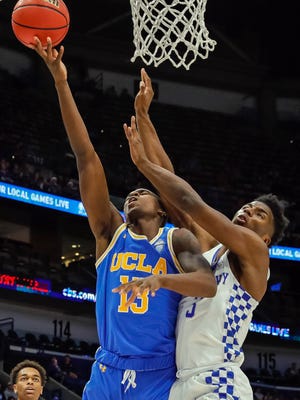 Dec 23, 2017; New Orleans, LA, USA; UCLA Bruins guard Kris Wilkes (13) is fouled going to the basket during the first half against Kentucky Wildcats at Smoothie King Center. Mandatory Credit: Stephen Lew-USA TODAY Sports