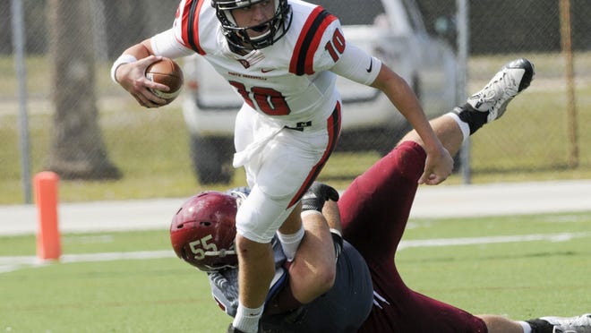 North Greenville QB Will Hunter is sacked by Skylar Sheffield of Florida Tech during Saturday's game.