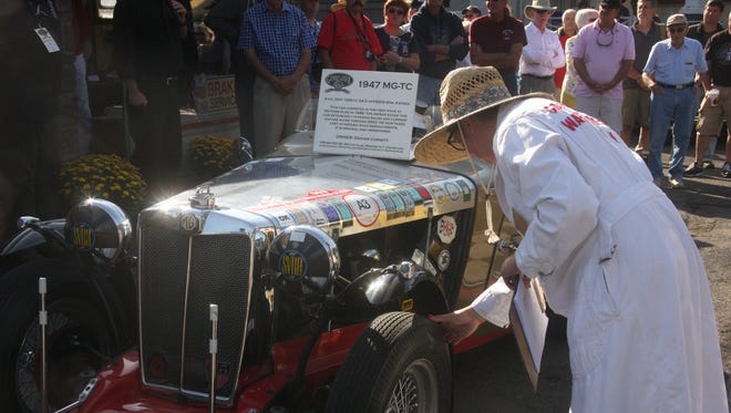 At the 2015 Watkins Glen Grand Prix Festival, Jennifer Sweet, of Watkins Glen,  in her role as Flossie Smalley, re-enacts the technical inspection that race cars had to go through at Smalley's garage during the street racing years.