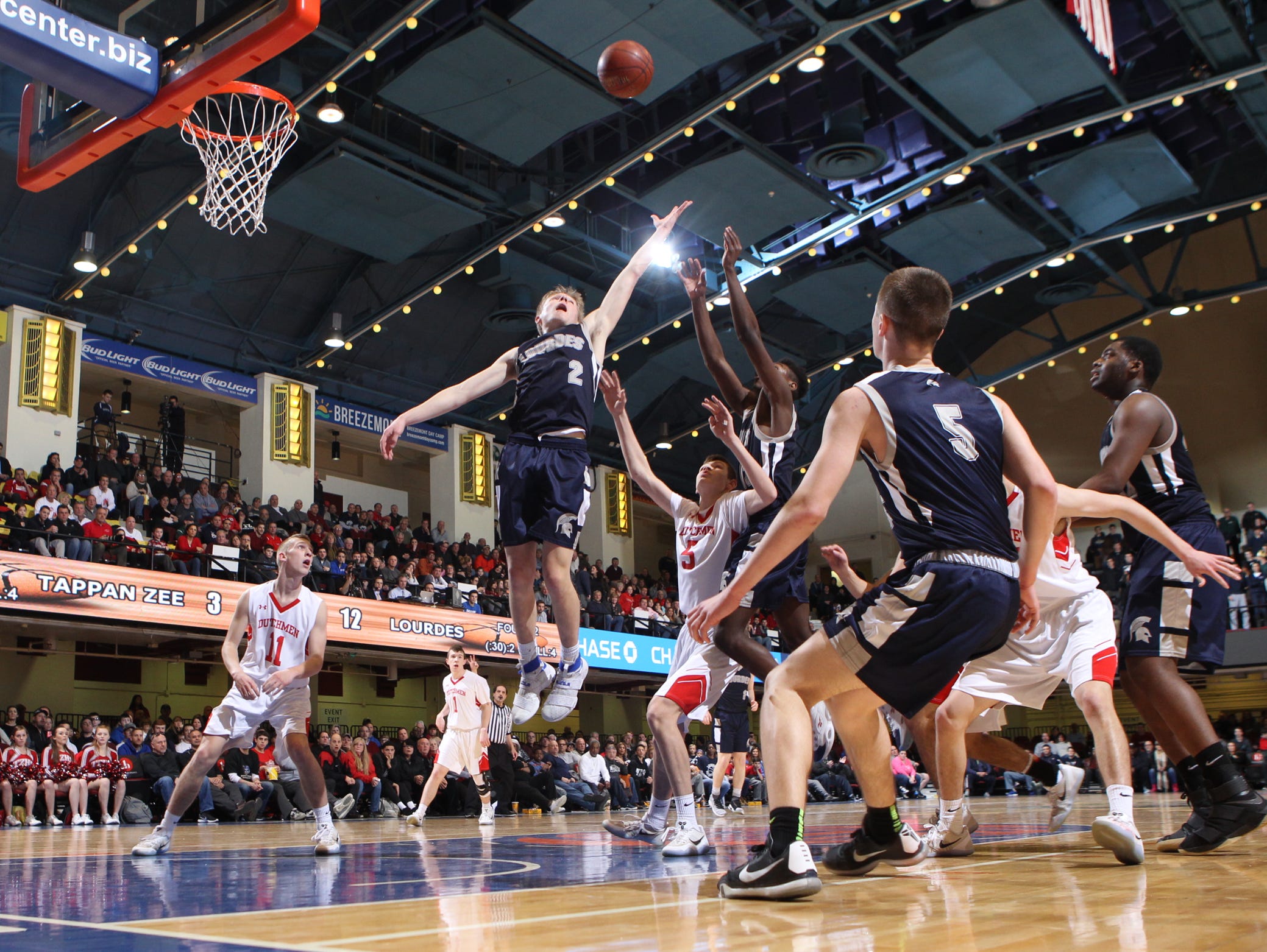 Lourdes' Joe Heavey (2) leaps for a rebound during their 42-38 win over Tappan Zee in the Section 1 Class A boys championship basketball game at the Westchester County Center in White Plains on Sunday, March 5, 2017.