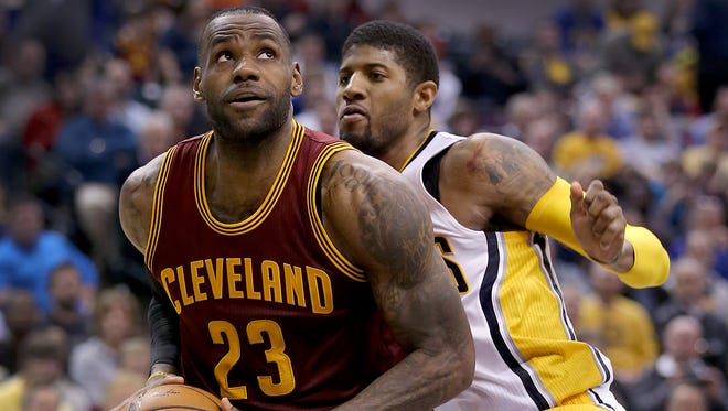 Cleveland Cavaliers forward LeBron James (23) drives on Indiana Pacers forward Paul George (13) in the second half of their game Monday, Feb 1, 2016, evening at Bankers Life Fieldhouse. The Indiana Pacers lost to the Cleveland Cavaliers 106-111.