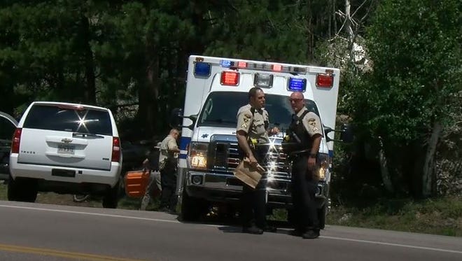 Authorities at the scene near where a man's body was found on Friday, July 20.