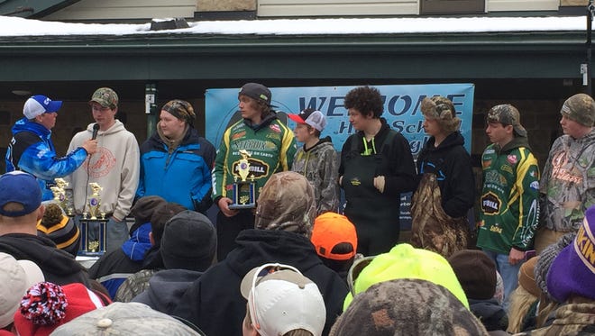 The D.C. Everest fishing team accepts its fourth-place trophy.