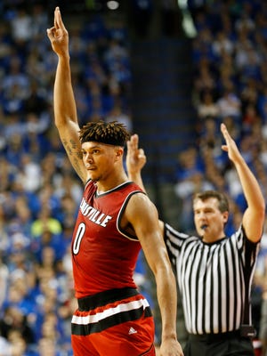 Louisville's Damion Lee signals he just knocked down a three.Dec. 26, 2015 