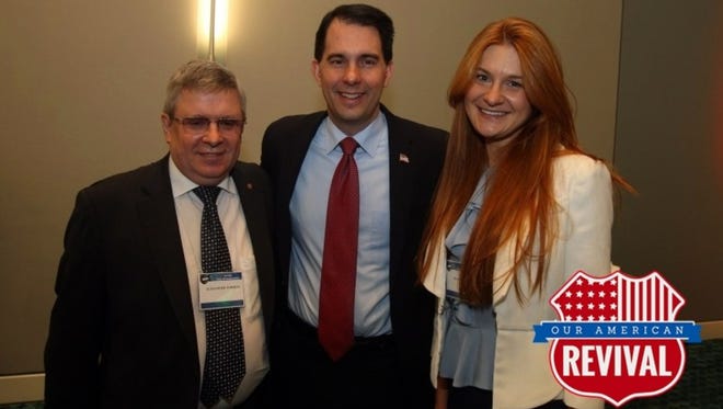 Gov. Scott Walker is pictured in 2015 with Alexander Torshin and Maria Butina. Butina was charged in July 2018 with attempting to help Russia interfere with U.S. politics.