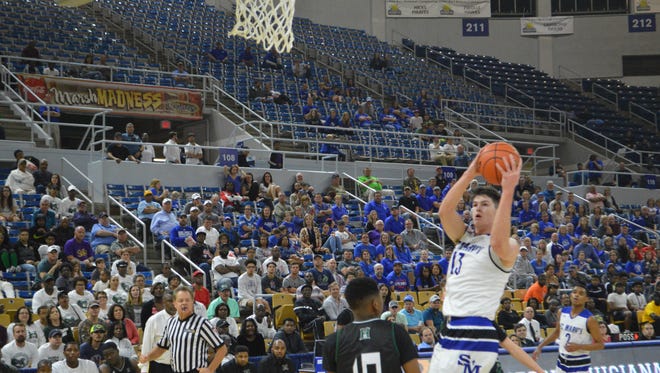 St. Mary's center Thomas Howell (13) goes for 2 against Hamilton Christian in the Division IV semifinals last year.