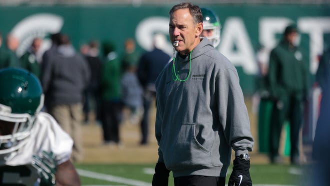 Michigan State football coach Mark Dantonio watches players during the first spring practice Tuesday, March 24, 2015, at the Duffy Daugherty Football Building in East Lansing.