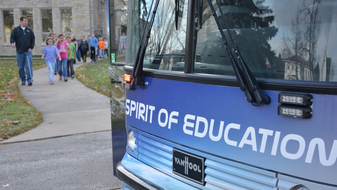 Algoma fifth-graders and their teacher Mr. Schmidt walk up to the Spirit of Education STEM shuttle to explore outer space on Nov. 13.