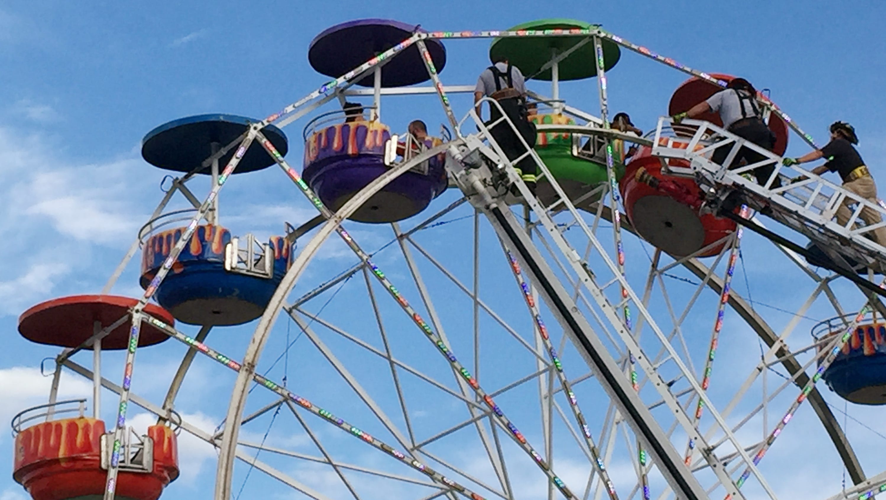 1 girl critically injured in fall from fair's Ferris wheel
