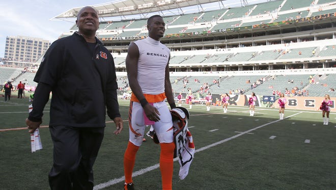 Bengals offensive coordinator Hue Jackson, left, is only concerned about winning football games, not stats.