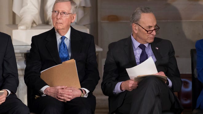 Senate Majority Leader Mitch McConnell, R-Ky., left, and Senate Minority Leader Charles Schumer, D-N.Y., seen here during a ceremony at the Capitol on Jan. 17, 2018, will lead negotiations that will decide the fate of undocumented immigrants brought to the country as children, known as "DREAMers."