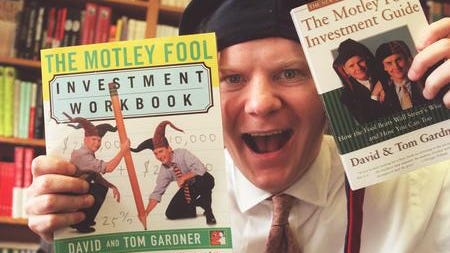 Tom Gardner is shown here with copies of two of the Motley Fool investment books he and his brother, David , have produced.