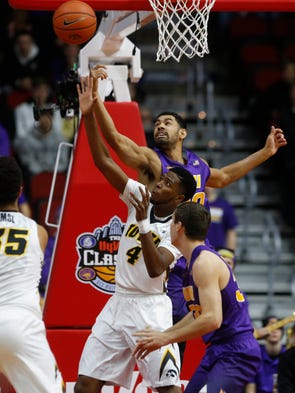 Iowa guard Isaiah Moss (4) and Northern Iowa guard