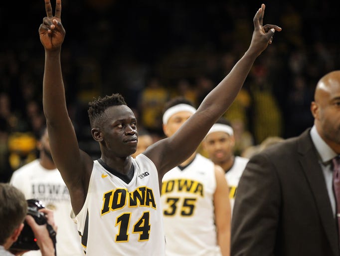 Peter Jok waves to fans following the Hawkeyes' NIT