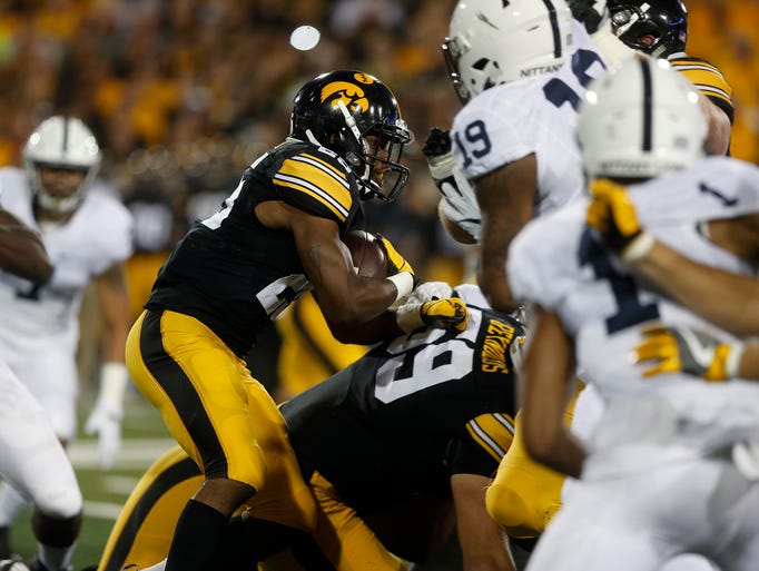 Iowa running back Akrum Wadley runs down field during
