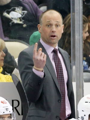 Feb 18, 2016; Pittsburgh, PA, USA; Detroit Red Wings head coach Jeff Blashill gestures behind the bench against the Pittsburgh Penguins during the second period at the CONSOL Energy Center.