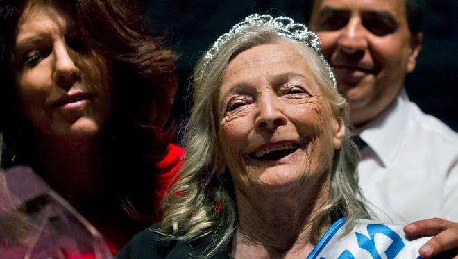 Czech-born Israeli  Shoshana Kolmer, 94,  smiles after winning the Miss Holocaust Survivor Beauty Contest in Haifa, Israel.  Kolmer was liberated from the Auschwitz camp in Poland. She told a story of how she would sing a song to a Nazi guard  each day, and for that, she received a small extra piece of bread. She immigrated to Israel in 1946.