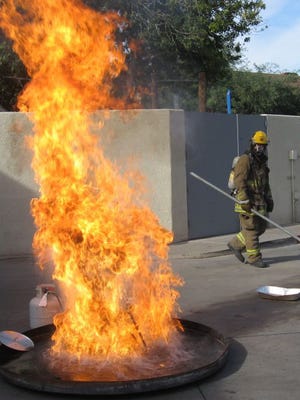 Phoenix firefighters on Monday demonstrate the dangers of deep-frying turkeys on Thanksgiving.