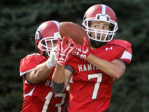Sussex Hamilton's Alex Kroening battles for a Wauwatosa