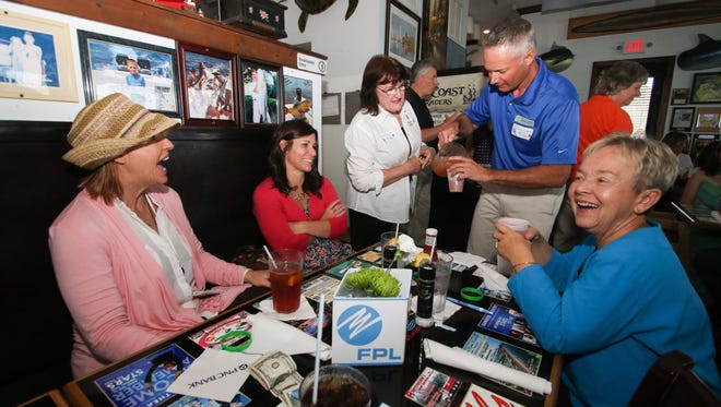 St. Lucie County Tax Collector Chris Craft serves guests at the inaugural Local Celebrity Lunch benefiting Donate Life Florida on April 3, 2016, at Chuck's Seafood in Fort Pierce.